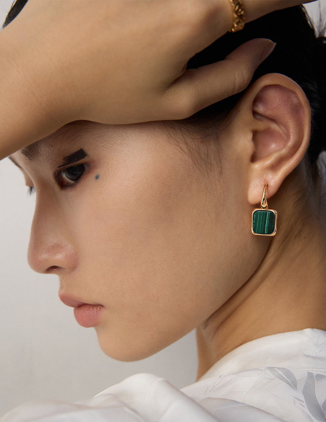 Square Malachite Silver Earrings worn by a model