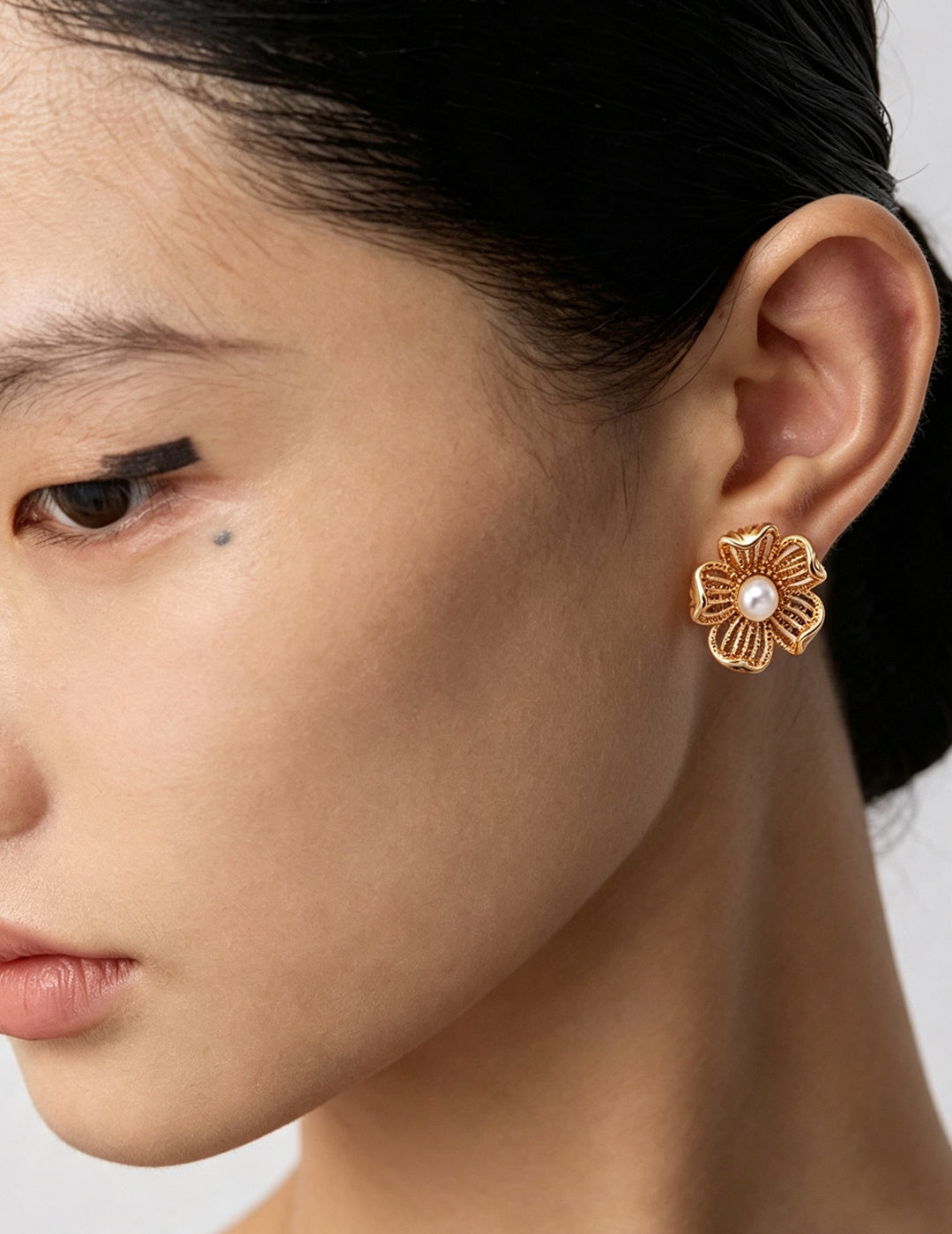 Pearl Blossom Silver Earrings worn by a model