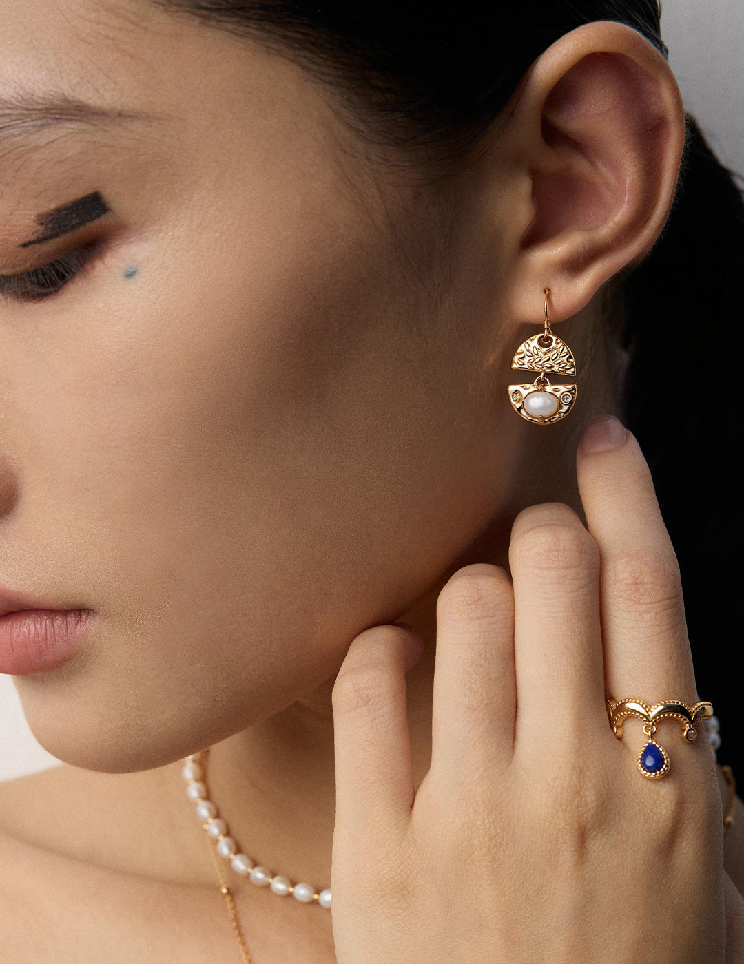 Moonlight Shell Silver Earrings worn by a model