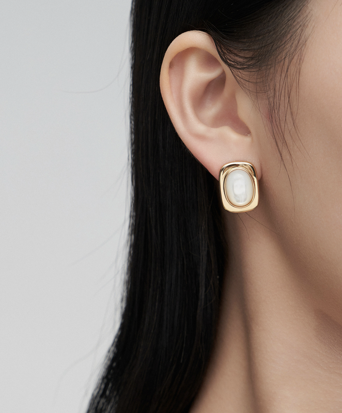 Oval Mother-of-Pearl Silver Earrings worn by a model