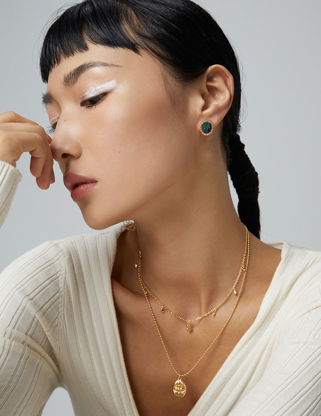 Oval Malachite Silver Studs worn by a model